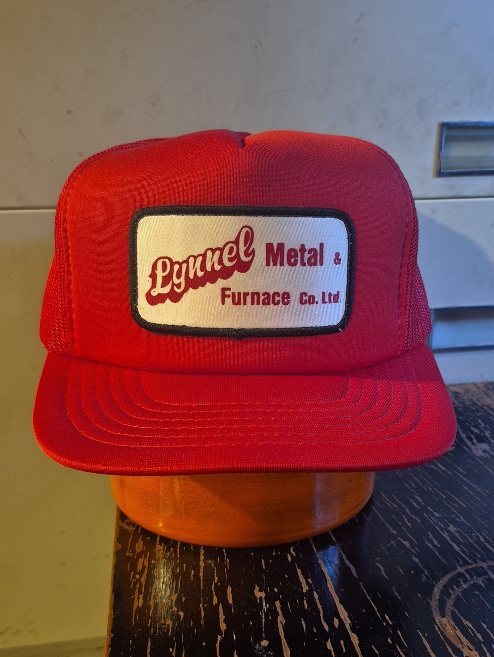 Lynnel Metal & Furnace Red Trucker Cap